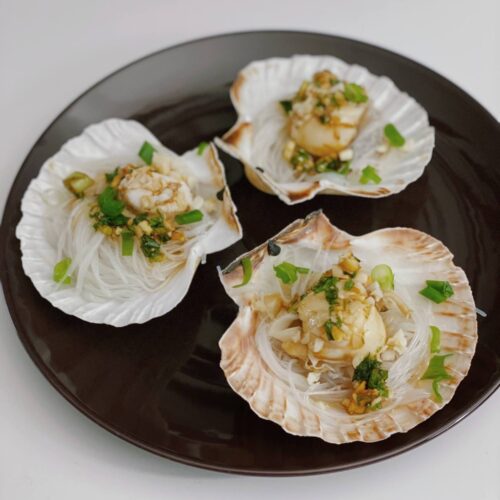 scallops on shell on plate